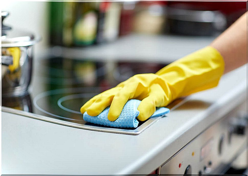 Hand cleaning the hob