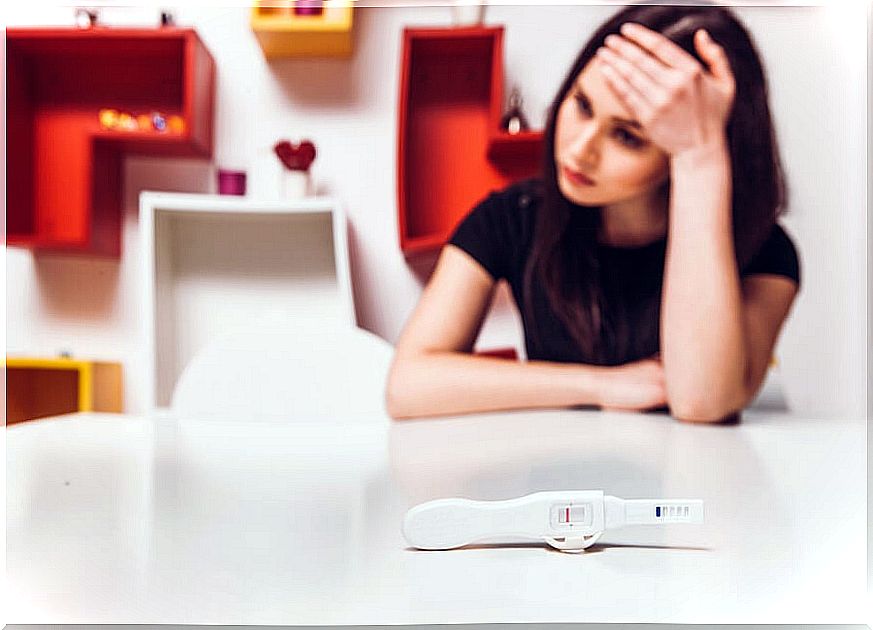 Woman with a pregnancy test