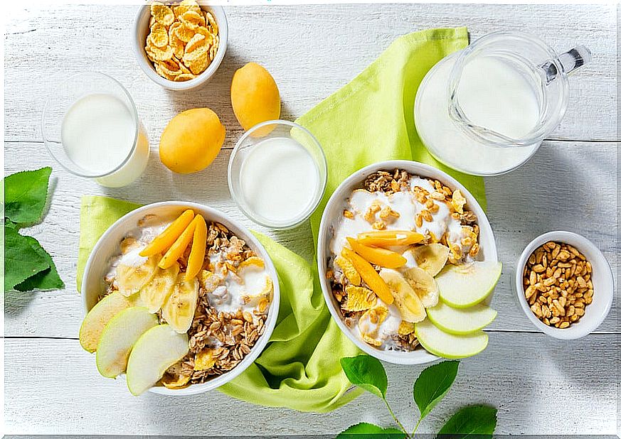 Breakfast with apples, cereal and fruit