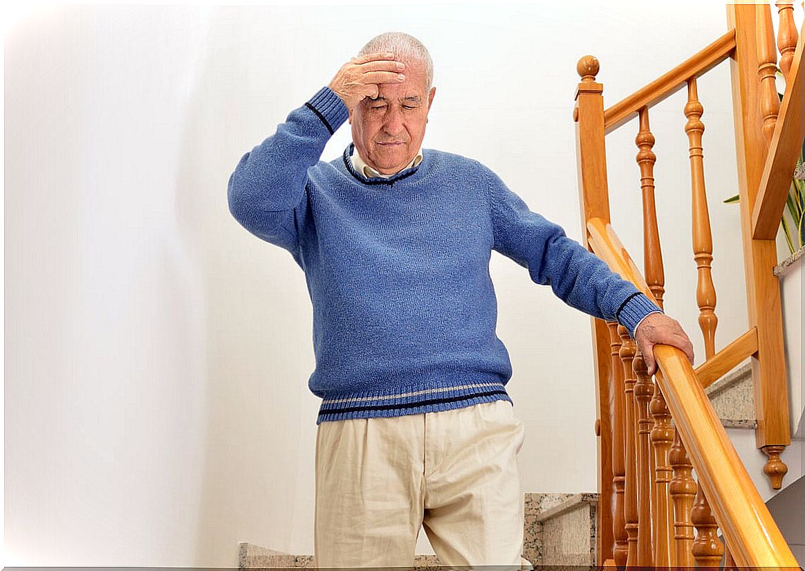 Older person with cognitive impairment descends stairs.