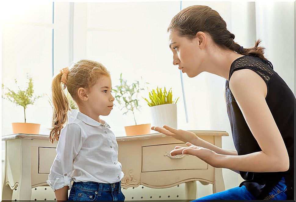 Mother explaining to her daughter that lying is wrong