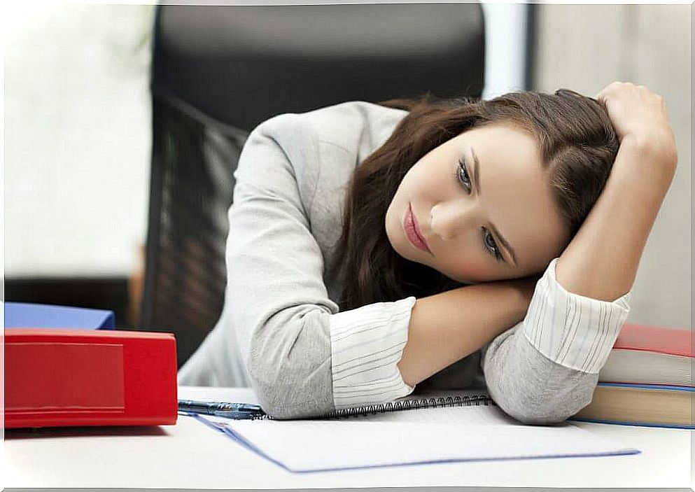 Woman with head lying on table