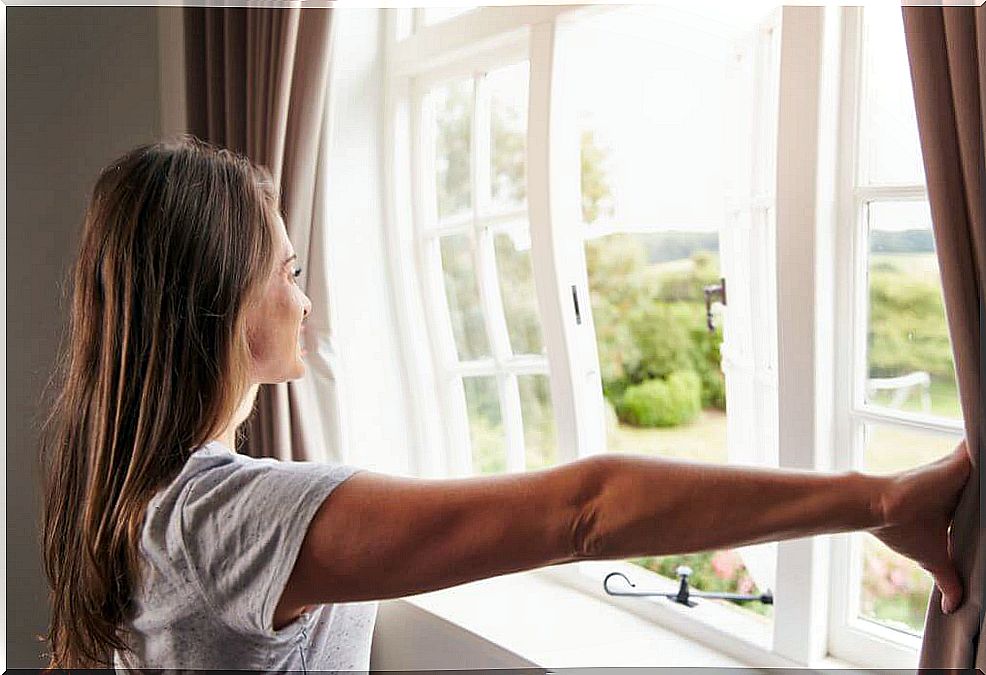 Woman opening the window