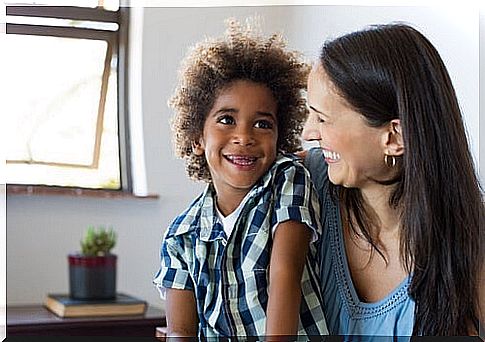 Mother talking to her smiling son