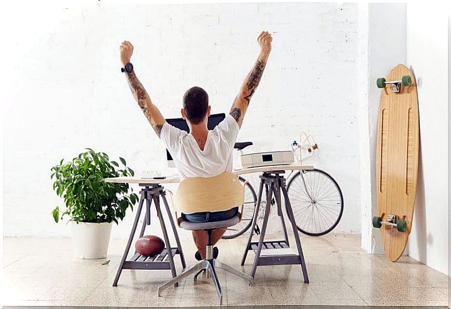 Boy on his back stretching on the work table.