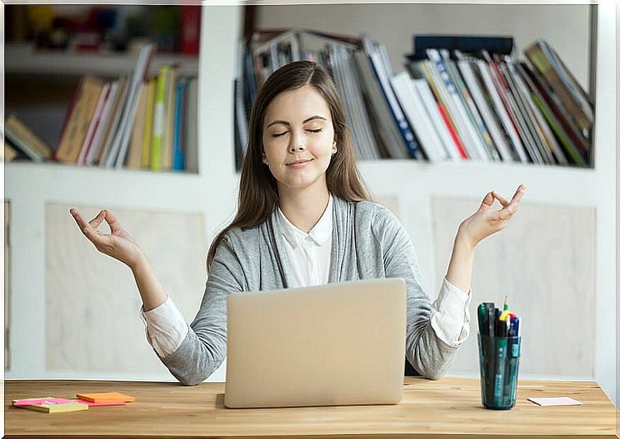 Woman meditating at work