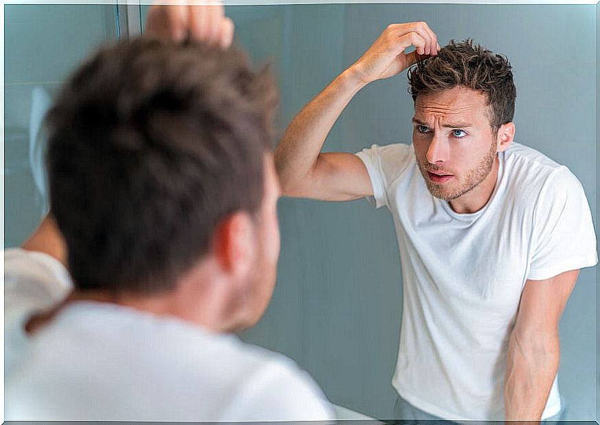 Man with stress noticing a gray hair