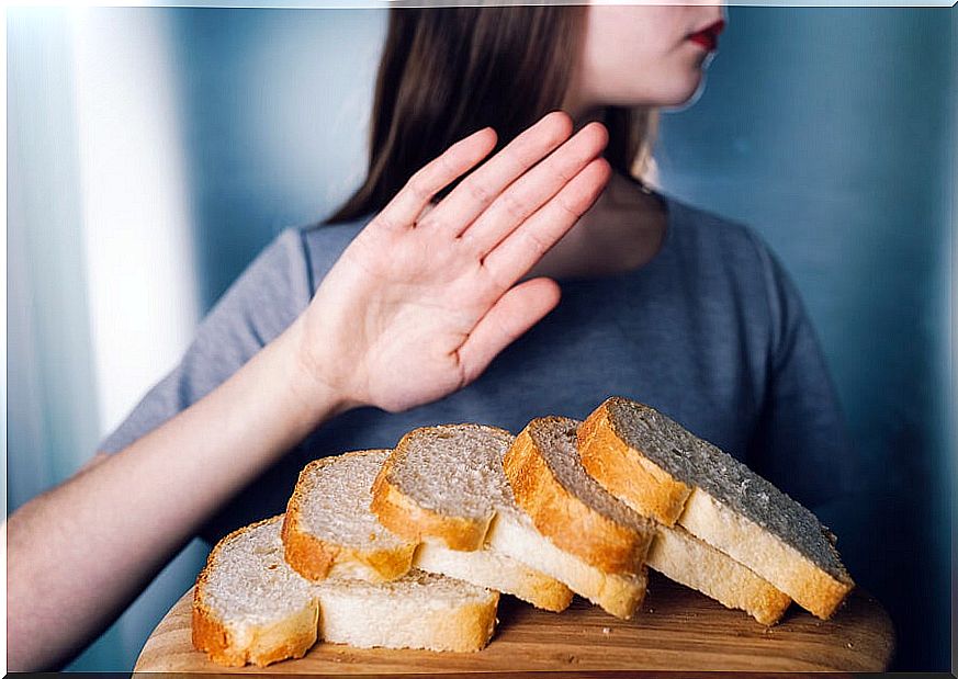 Woman rejecting pieces of bread